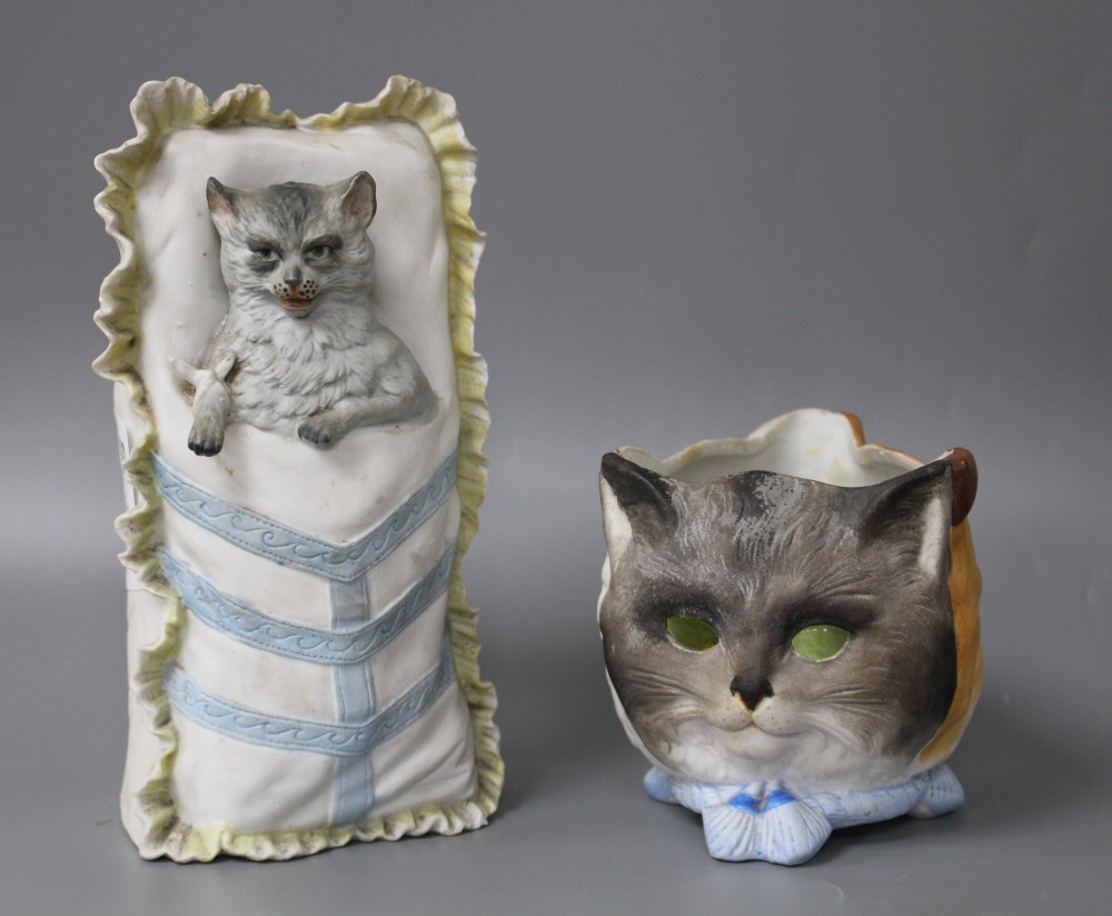 Two 19th century German coloured bisque novelty ornaments, one a night light modelled with cats, dog and owls faces, with coloured glas
